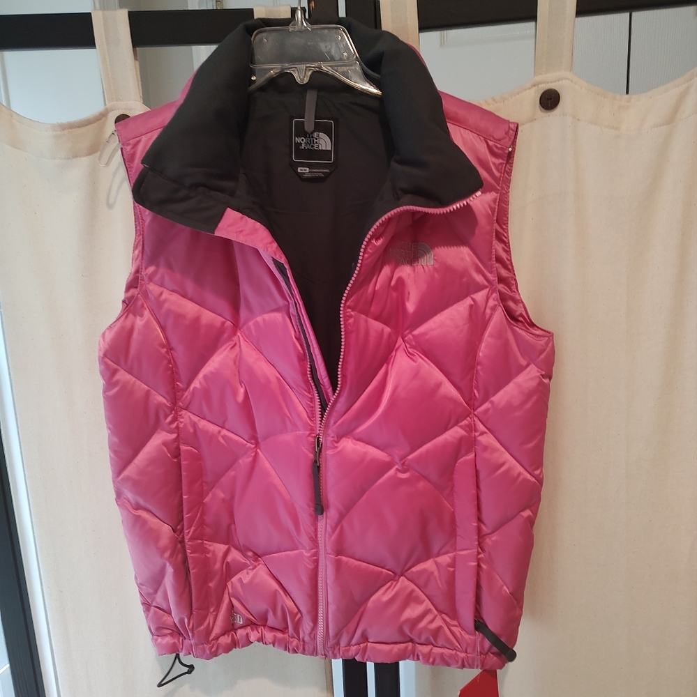 NWT North Face puffer vest. Pink and black size medium.